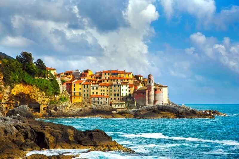 Acouple of buildings at the coast of a sea